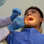 how to manage and reduce pain and swelling after tooth extraction treatment